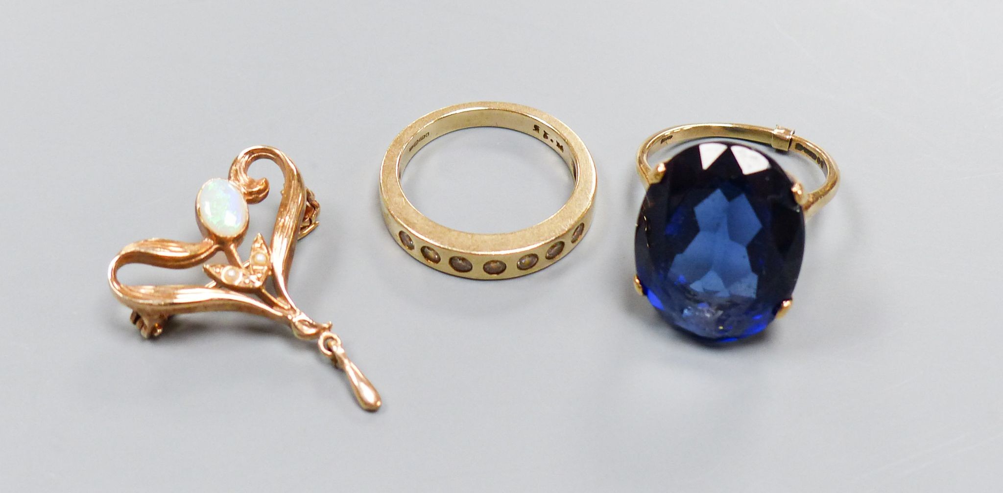 A modern 9ct gold Art Nouveau style gem set pendant and two 9ct and gem set rings, gross 14.2 grams.